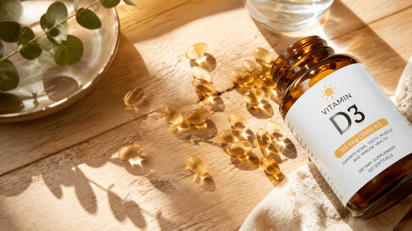Capsule di vitamina D3 su tavolo di legno con raggi solari
